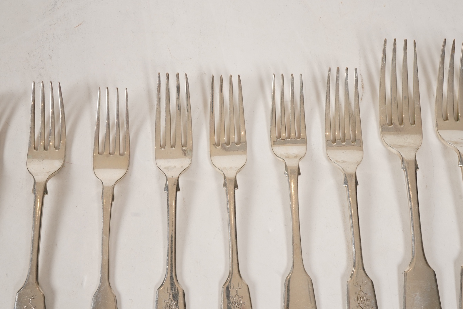 A set of twelve early Victorian provincial silver fiddle pattern table forks and six dessert forks by William Rawlings Sobey, Exeter, 1838, engraved 'Susanna Kingdon'